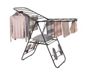 Black folding clothes drying rack with clothes.