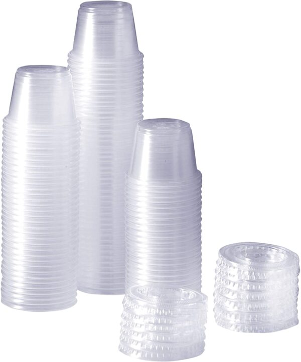 Stacks of clear plastic cups and lids.