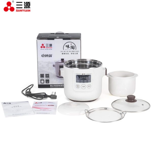 White electric multi-cooker with lid and tray.