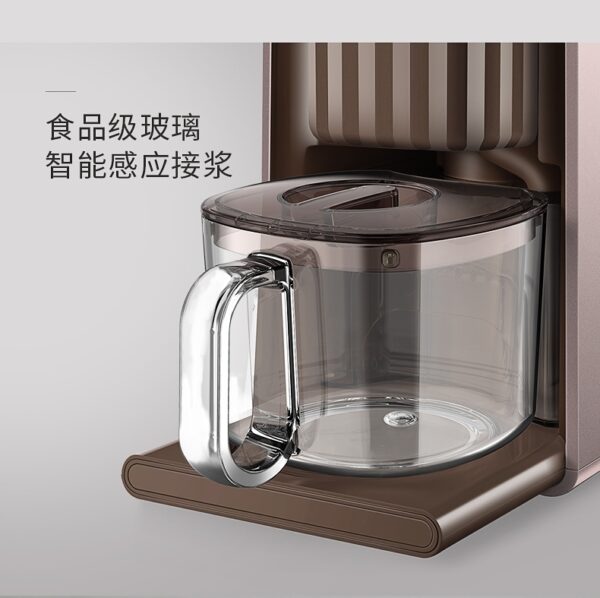 A coffee maker with the lid open and it's glass container.