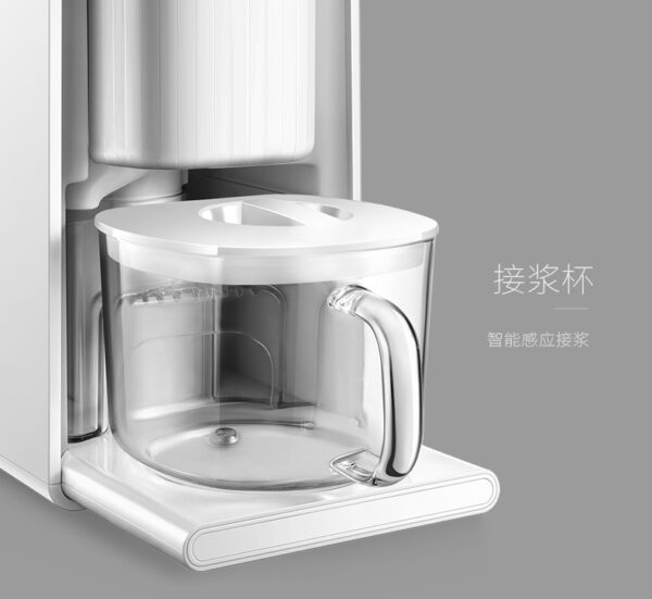 A white coffee maker with a glass bowl.