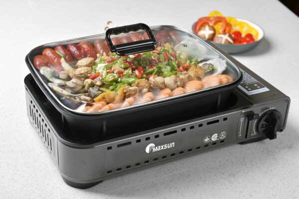 Seafood and sausage cooking on a stovetop.