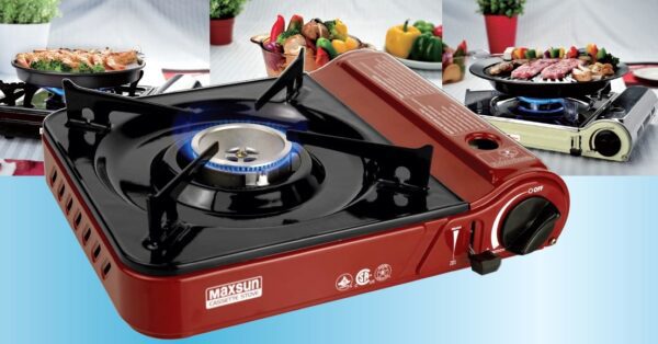 Red portable gas stove with blue flame.