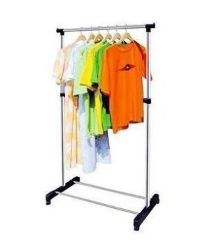 A silver clothes rack with clothes on it.