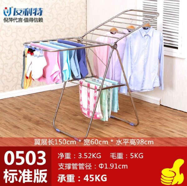 Foldable clothes drying rack with clothes.