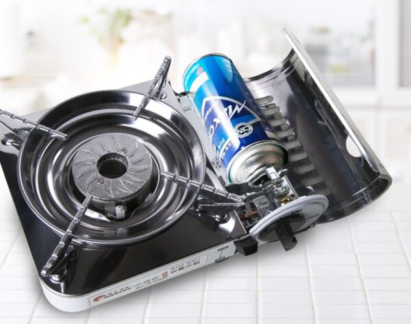 Portable butane gas stove with canister.