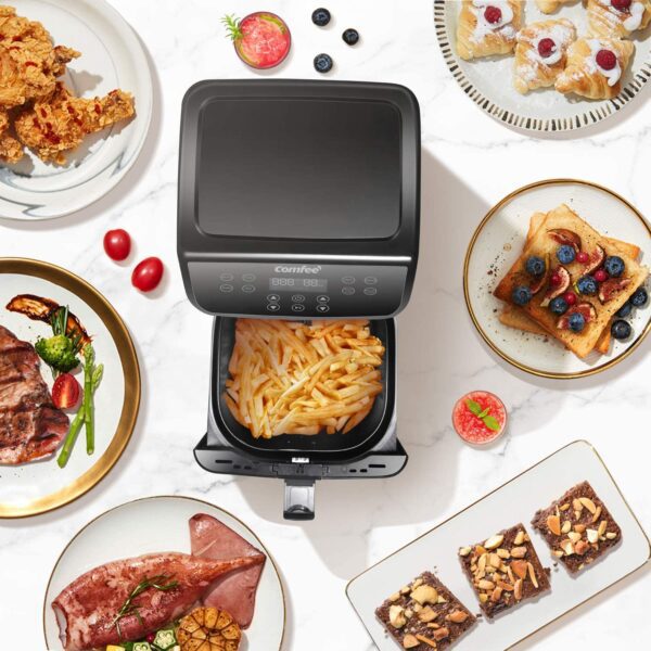 Black air fryer with crispy french fries.