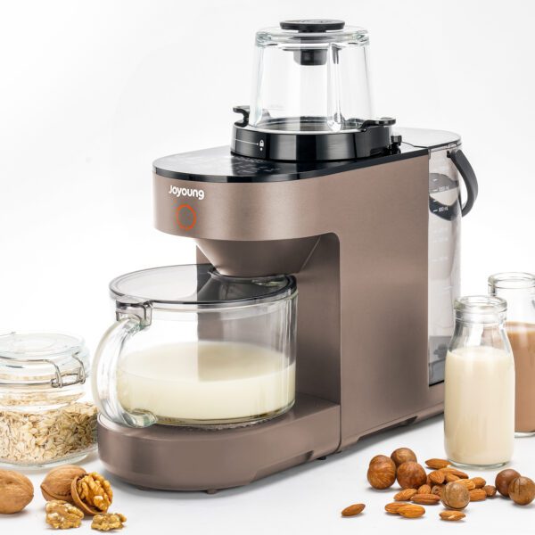 Brown nut milk maker with almond milk.