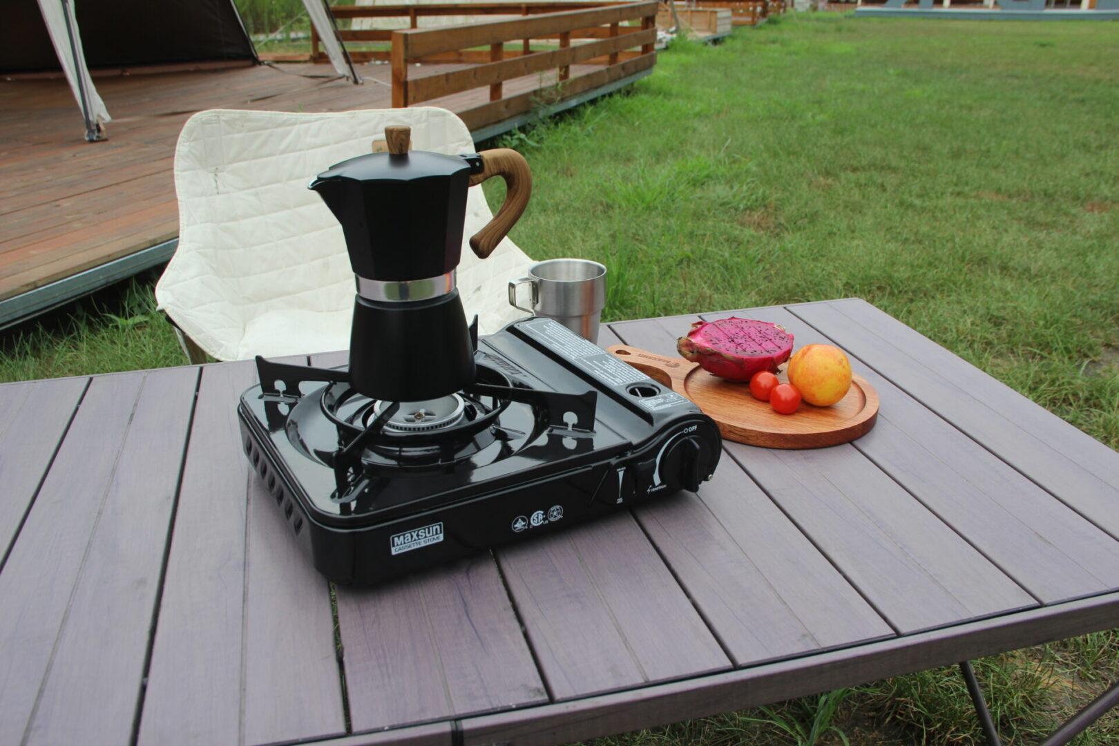 Black Maxsun MS-3800 cassette stove heating a coffee maker outdoors